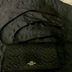 Coach crossbody clutch/ Black and Burgundy.